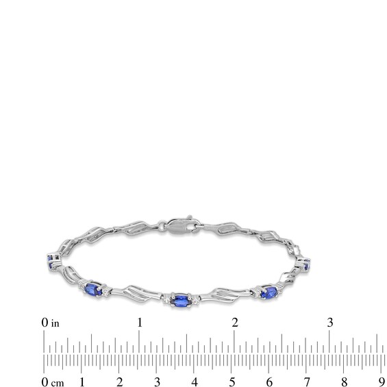 Oval Blue and White Lab-Created Sapphire Bypass Wave Alternating Line Bracelet in Sterling Silver - 7.25"