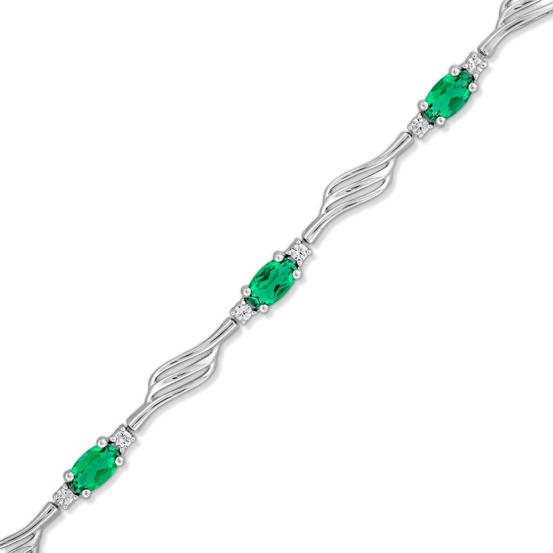 Main Image 1 of Oval Lab-Created Emerald and White Lab-Created Sapphire Bypass Wave Alternating Line Bracelet in Sterling Silver