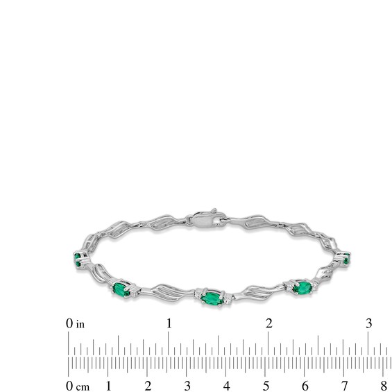 Oval Lab-Created Emerald and White Lab-Created Sapphire Bypass Wave Alternating Line Bracelet in Sterling Silver