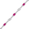 Thumbnail Image 1 of Oval Lab-Created Ruby and White Lab-Created Sapphire Bypass Wave Alternating Line Bracelet in Sterling Silver - 7.25"