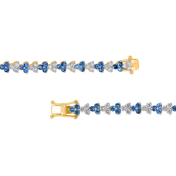 Blue Sapphire and 2-1/2 CT. T.w. Diamond Alternating Trios Tennis Bracelet in 10K Gold
