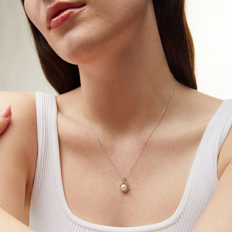 Main Image 2 of 7.0mm Button Freshwater Cultured Pearl and 1/10 CT. T.W. Diamond Infinity Pendant in 10K White Gold
