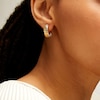 Thumbnail Image 1 of 16.44mm Ribbed Huggie Hoop Earrings in Sculpted Hollow 14K Gold