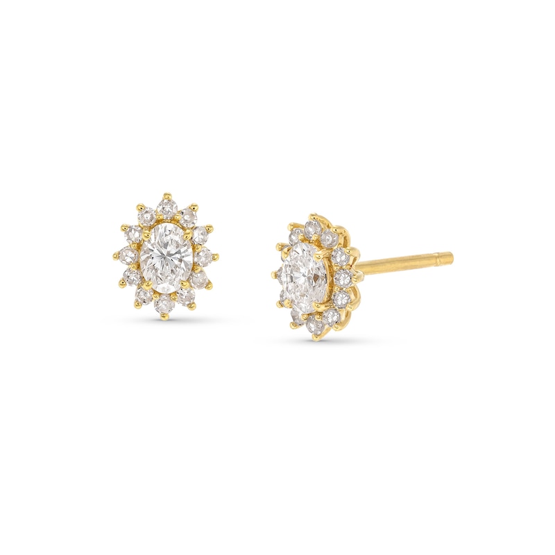 1/2 CT. T.W. Oval Diamond Sunburst Frame Stud Earrings in 10K Gold