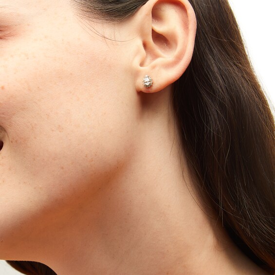 1/2 CT. T.w. Pear-Shaped Diamond Sunburst Frame Stud Earrings in 10K Gold
