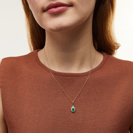 Oval Emerald and 1/6 CT. T.w. Diamond Scallop Frame Drop Pendant in 10K Gold
