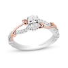 Thumbnail Image 0 of Enchanted Disney Belle 3/4 CT. T.W. Oval Diamond Crossover Rose Shank Engagement Ring in 14K Two-Tone Gold