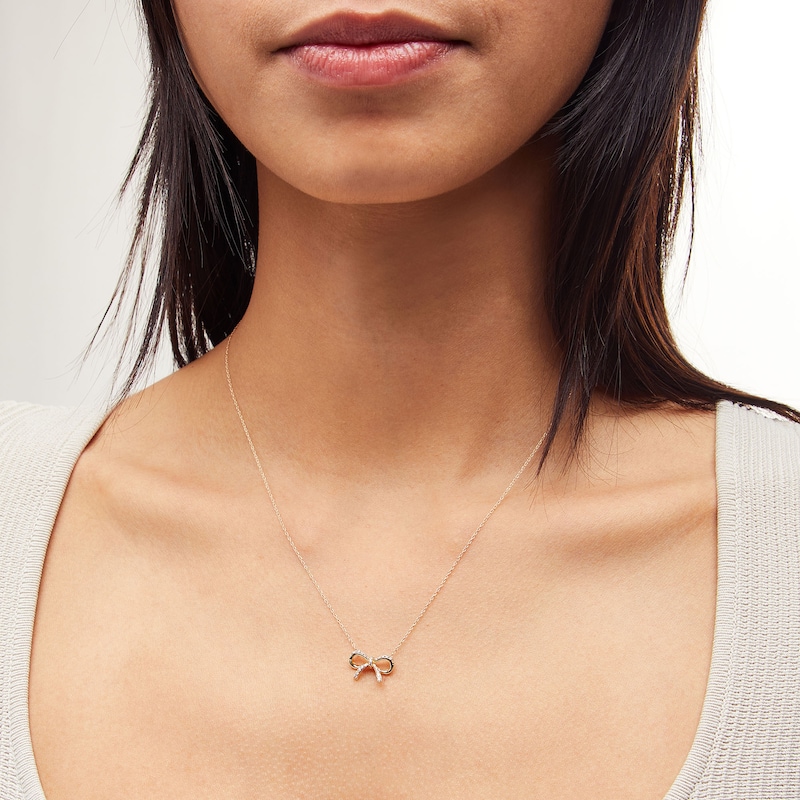 Main Image 2 of 1/10 CT. T.W. Diamond Bow Necklace in 10K Gold