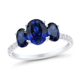 Oval Blue Lab-Created Sapphire and 1/5 CT. T.W. Certified Lab-Grown Diamond Three Stone Ring in 10K White Gold