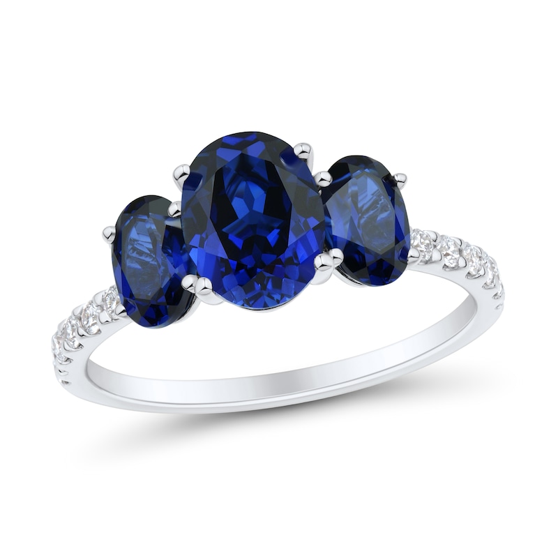 Main Image 1 of Oval Blue Lab-Created Sapphire and 1/5 CT. T.W. Certified Lab-Grown Diamond Three Stone Ring in 10K White Gold