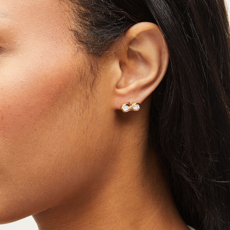 Main Image 2 of Zales x Nungu 3/4 CT. T.W. Diamond Infinity Stud Earrings in 14K Gold