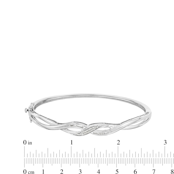 1/5 CT. T.w. Baguette and Round Diamond Infinity Twist Bangle in Sterling Silver - 7.84"
