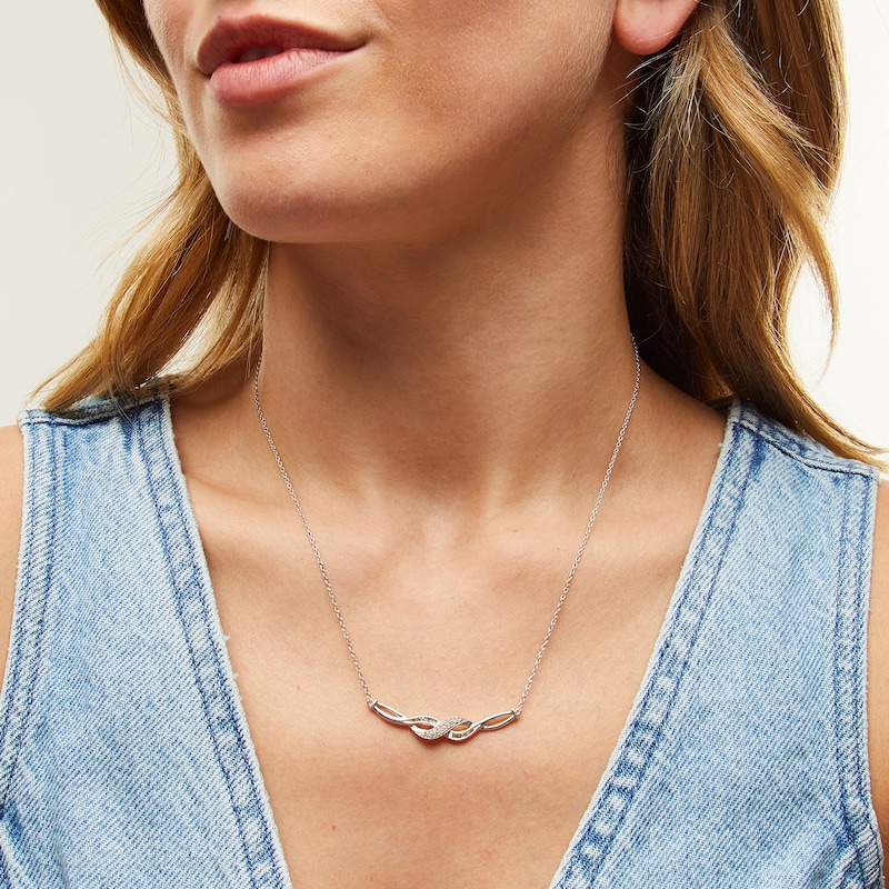 Main Image 2 of 1/5 CT. T.W. Baguette and Round Diamond Infinity Twist Necklace in Sterling Silver
