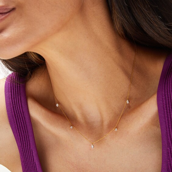 1/4 CT. T.w. Pear-Shaped and Round Diamond Station Dangle Necklace in 10K Gold
