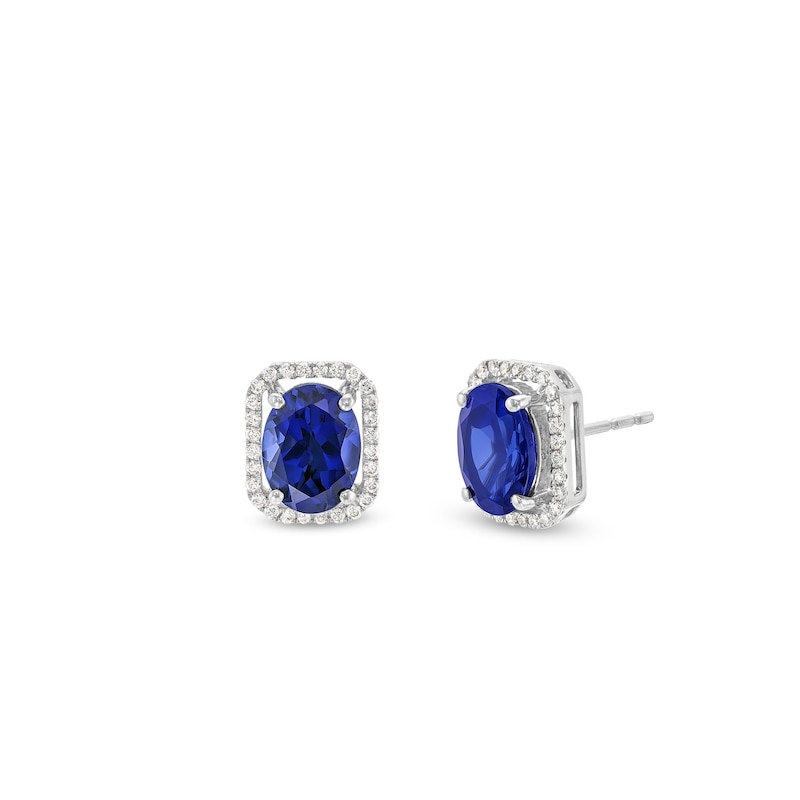 Main Image 1 of Oval Blue Lab-Created Sapphire and 1/6 CT. T.W. Diamond Open Octagon Frame Stud Earrings in 10K White Gold