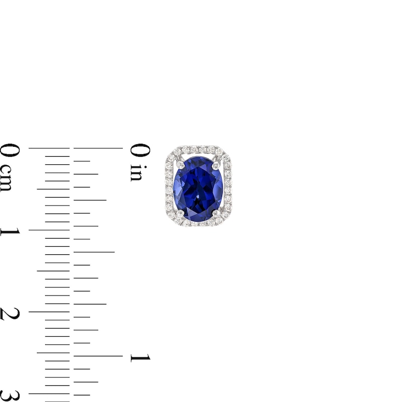 Main Image 3 of Oval Blue Lab-Created Sapphire and 1/6 CT. T.W. Diamond Open Octagon Frame Stud Earrings in 10K White Gold