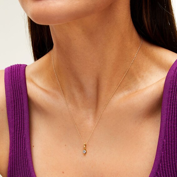 1/10 CT. Diamond Solitaire Marquise Frame Drop Pendant in 10K Gold