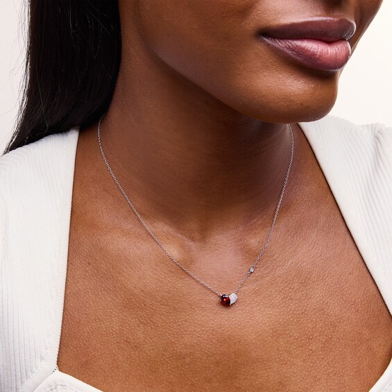 Pear-Shaped Garnet and 1/10 CT. T.w. Multi-Diamond Toi et Moi Heart Necklace in Sterling Silver