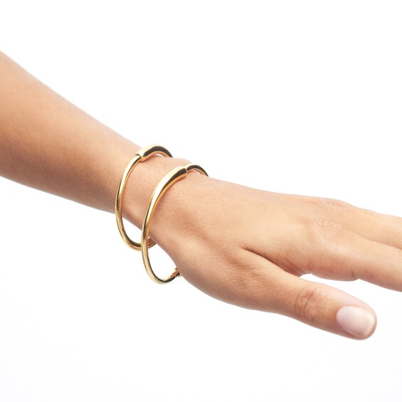 PDPAOLAâ¢ at Zales Graduated Loop Bangle in Brass with 18K Gold Plate - 6.83"
