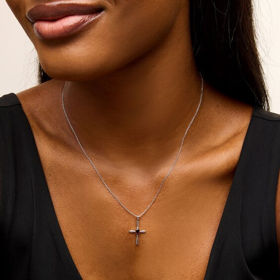 Oval Garnet and Diamond Accent Flared Cross Pendant in Sterling Silver
