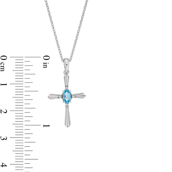 Oval Swiss Blue Topaz and Diamond Accent Flared Cross Pendant in Sterling Silver