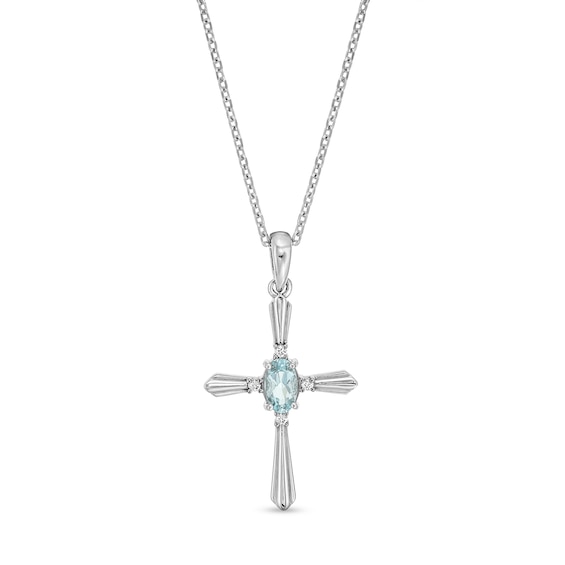Oval Simulated Aquamarine and Diamond Accent Flared Cross Pendant in Sterling Silver