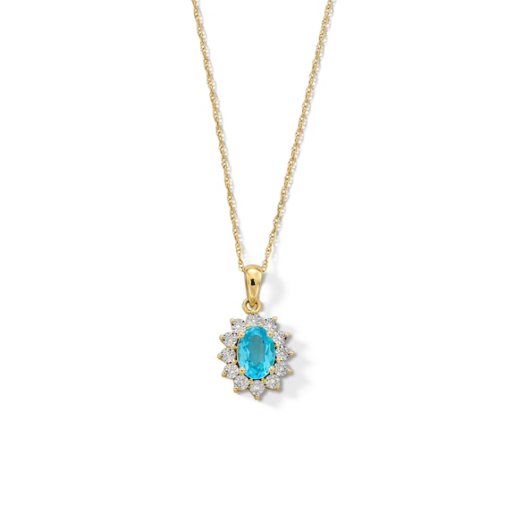 Oval Swiss Blue Topaz and Diamond Accent Sunburst Frame Pendant in 10K Gold