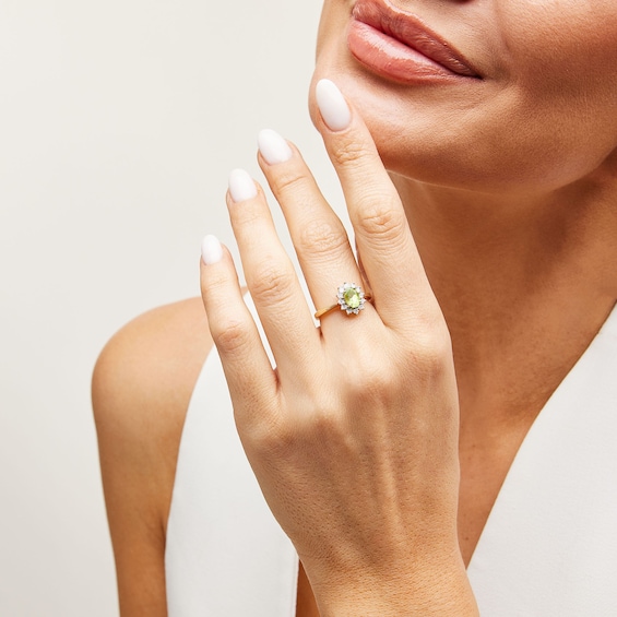 Oval Peridot and Diamond Accent Sunburst Frame Ring in 10K Gold