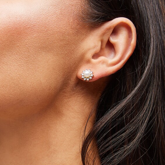 5.0mm Freshwater Cultured Pearl and 1/20 CT. T.w. Diamond Sunburst Frame Stud Earrings in 10K Gold