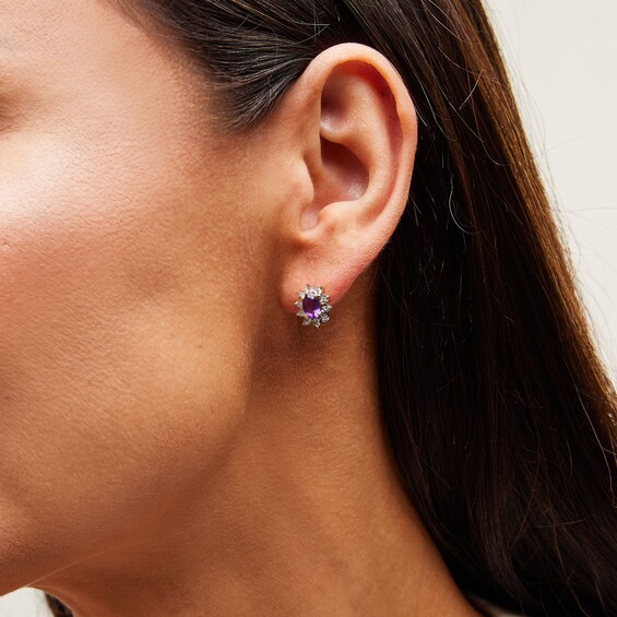 Oval Amethyst and 1/20 CT. T.w. Diamond Sunburst Frame Stud Earrings in 10K Gold