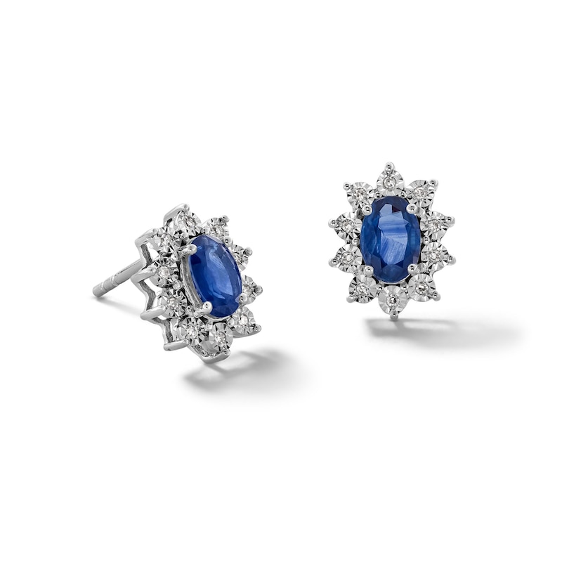 Main Image 1 of Oval Blue Sapphire and 1/20 CT. T.W. Diamond Sunburst Frame Stud Earrings in 10K White Gold
