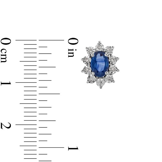 Oval Blue Sapphire and 1/20 CT. T.w. Diamond Sunburst Frame Stud Earrings in 10K White Gold