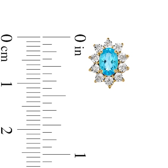 Oval Swiss Blue Topaz and 1/20 CT. T.w. Diamond Sunburst Frame Stud Earrings in 10K Gold