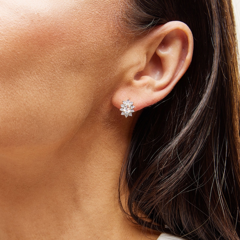 Main Image 2 of Oval White Lab-Created Sapphire and 1/20 CT. T.W. Diamond Sunburst Frame Stud Earrings in 10K Gold