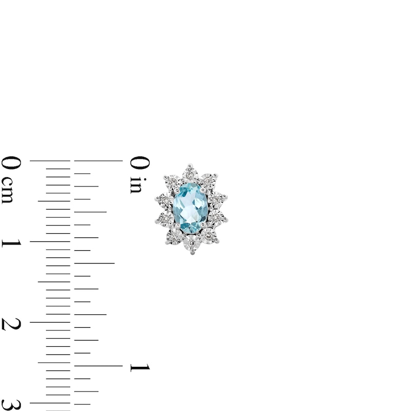 Main Image 3 of Oval Aquamarine and 1/20 CT. T.W. Diamond Sunburst Frame Stud Earrings in 10K White Gold