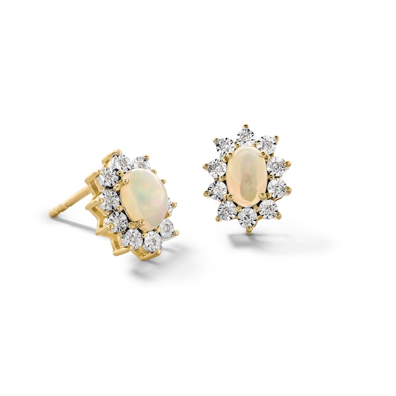 Oval Opal and 1/20 CT. T.w. Diamond Sunburst Frame Stud Earrings in 10K Gold