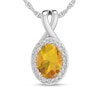 Thumbnail Image 1 of Oval Citrine and 1/15 CT. T.W. Diamond Frame Split Bail Pendant in 10K White Gold