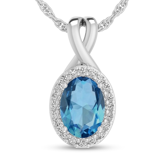Oval Swiss Blue Topaz and 1/15 CT. T.w. Diamond Frame Split Bail Pendant in 10K White Gold