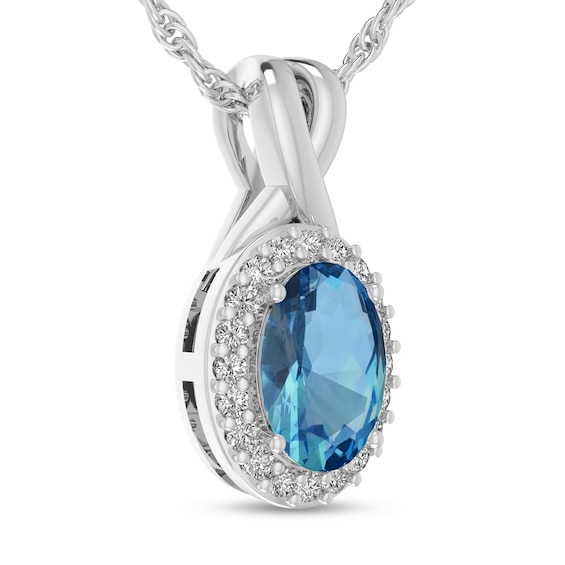 Oval Swiss Blue Topaz and 1/15 CT. T.w. Diamond Frame Split Bail Pendant in 10K White Gold