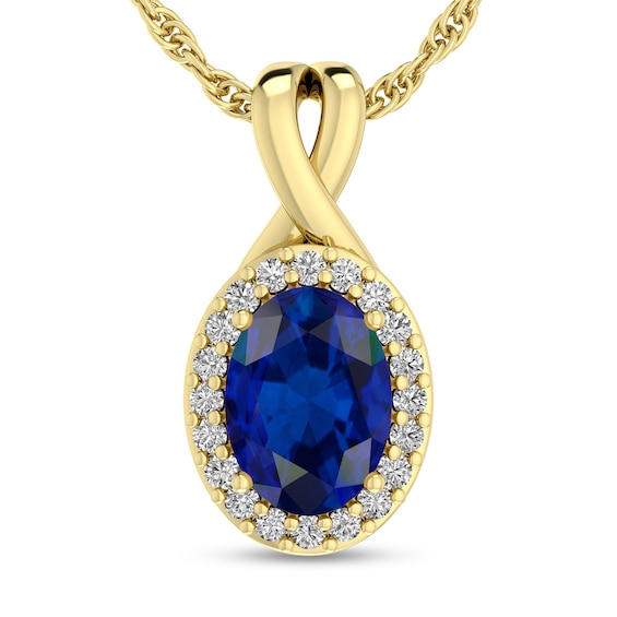 Oval Blue Sapphire and 1/15 CT. T.w. Diamond Frame Split Bail Pendant in 10K Gold