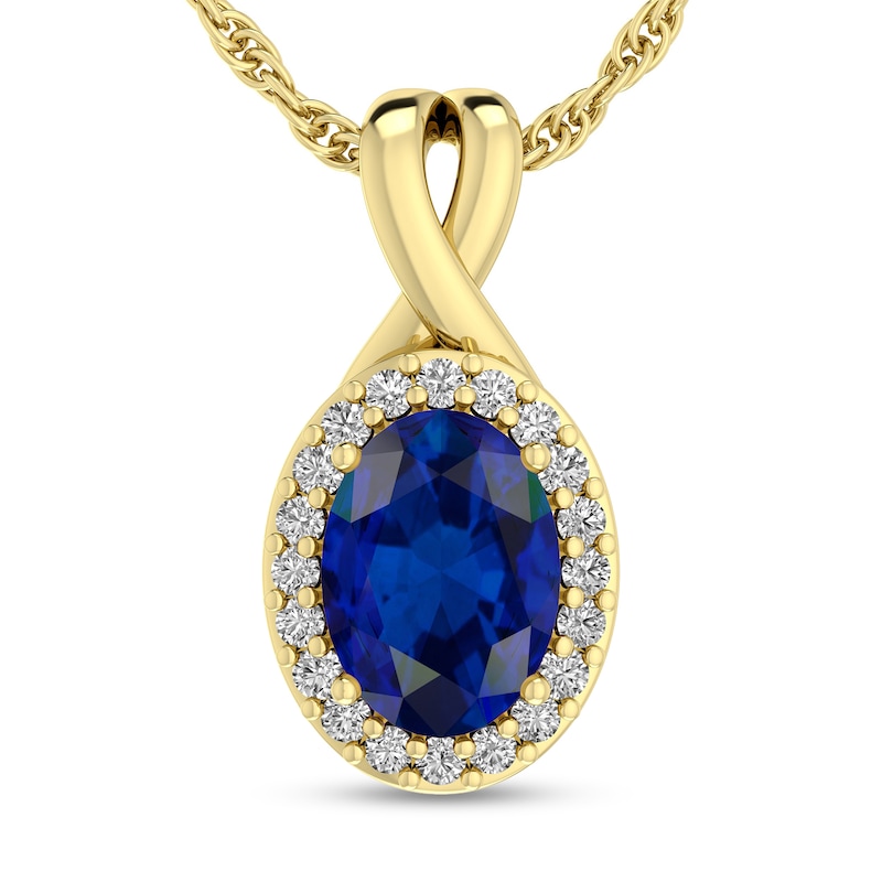 Main Image 1 of Oval Blue Sapphire and 1/15 CT. T.W. Diamond Frame Split Bail Pendant in 10K Gold