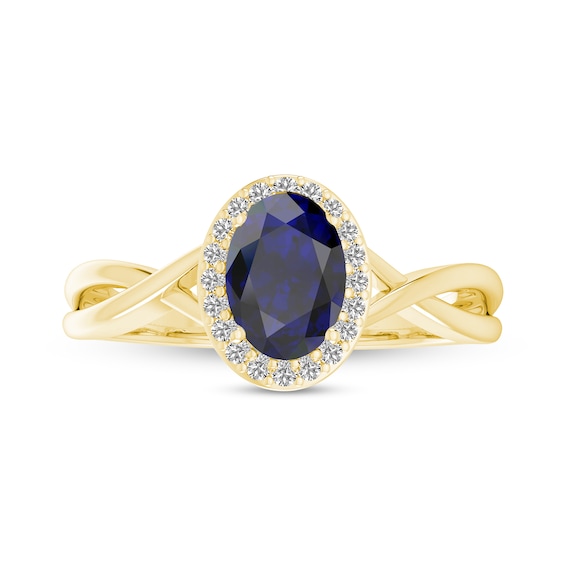 Oval Blue Sapphire and 1/15 CT. T.w. Diamond Frame Crossover Shank Ring in 10K Gold