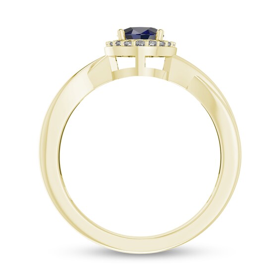 Oval Blue Sapphire and 1/15 CT. T.w. Diamond Frame Crossover Shank Ring in 10K Gold