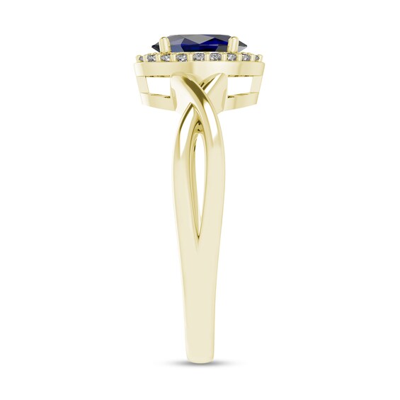Oval Blue Sapphire and 1/15 CT. T.w. Diamond Frame Crossover Shank Ring in 10K Gold