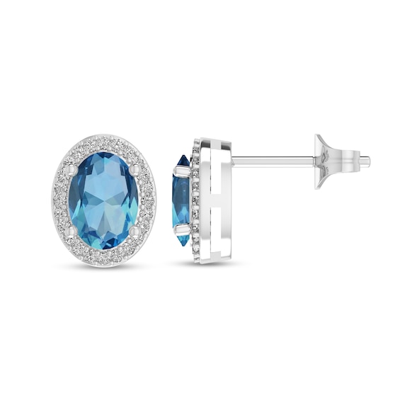 Oval Swiss Blue Topaz and 1/10 CT. T.w. Diamond Frame Stud Earrings in 10K White Gold