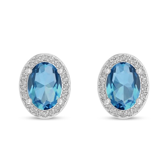 Oval Swiss Blue Topaz and 1/10 CT. T.w. Diamond Frame Stud Earrings in 10K White Gold
