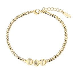 1/15 CT. T.W. Diamond Initial Station Charm Bead Strand Bracelet in Sterling Silver (3 Letters) - 8.0"