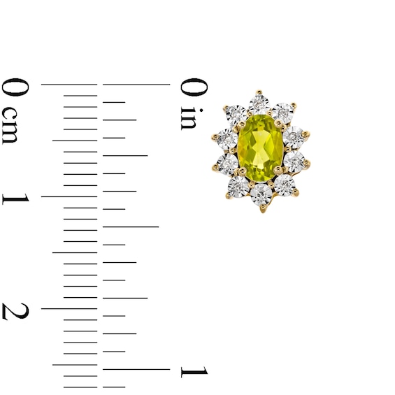 Oval Peridot and 1/20 CT. T.w. Diamond Sunburst Frame Stud Earrings in 10K Gold
