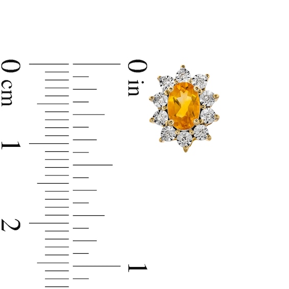 Oval Citrine and 1/20 CT. T.w. Diamond Sunburst Frame Stud Earrings in 10K Gold