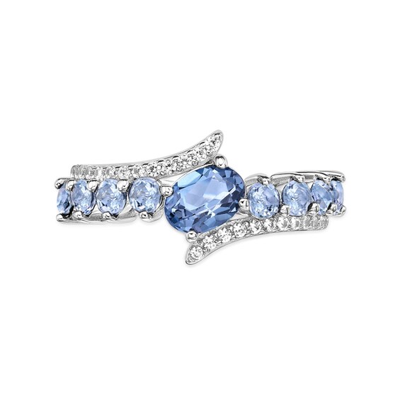 Oval and Round Sky Blue Topaz with White Topaz Bypass Ring in Sterling Silver